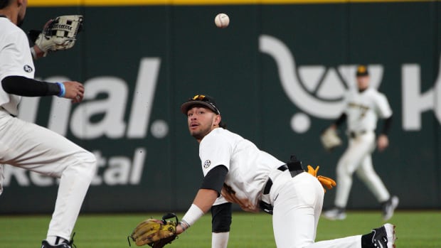 Feb 18, 2023; Arlington, TX, USA; Missouri Tigers infielder Matt Garcia (4) throws to infielder Justin Colon (12) in a 6-5 win against Texas Longhorns at Globe Life Field. Mandatory Credit: Dustin Safranek-USA TODAY Sports